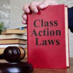 Class action laws are shown on the conceptual photo using the text